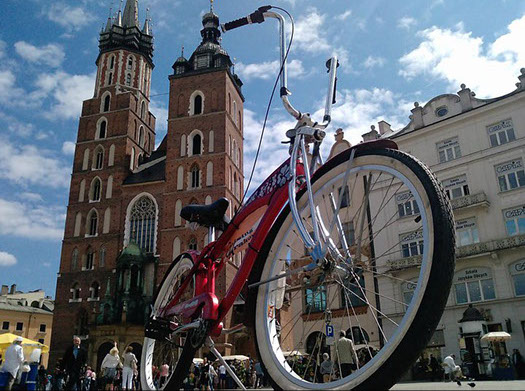 Red cruiser in front of Saint Mary's basilica in the main market square